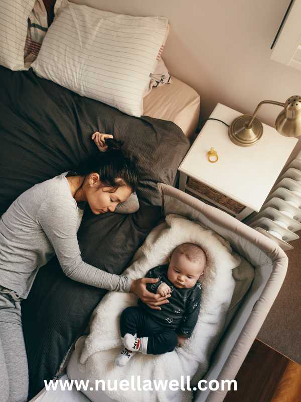 mom-putting-her-baby-to-bed