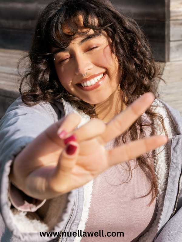 a-mom-smiling-with-a-peaceful-expression-in-signs-of-mom-burnout-and-how-to-recover