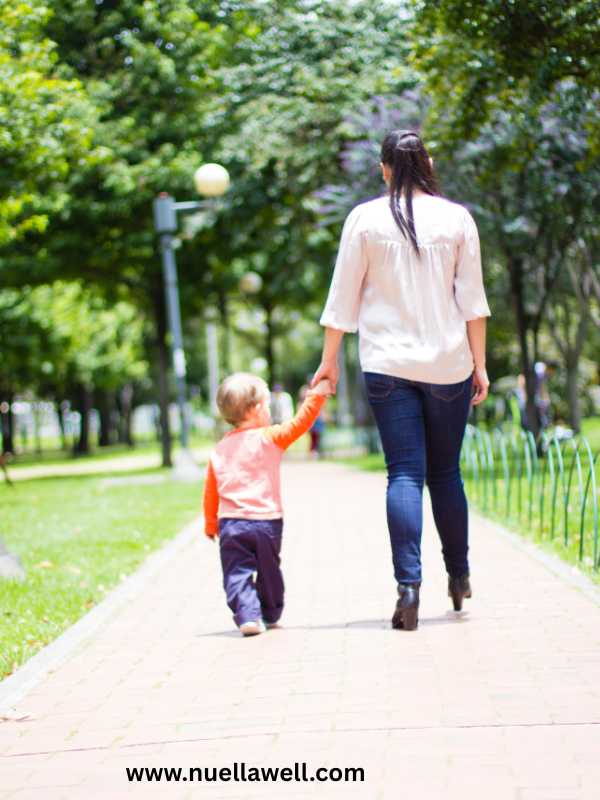a-mom-taking-a-walk-with-her-kids