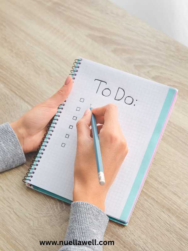 a-mom-writing-a-to-do-list-in-stress-management-tips-for-busy-moms