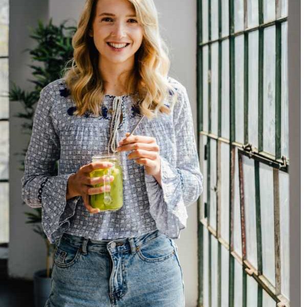 a-mom-holding-a-healthy-glass-of drink-for-healthy-habits-for-busy-mom