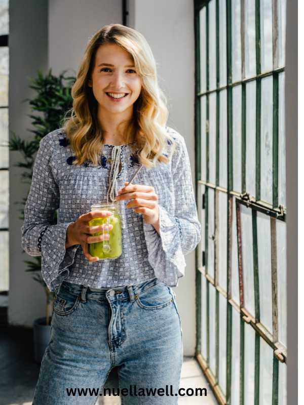 a-mom-holding-a-healthy-glass-of drink-for-healthy-habits-for-busy-mom