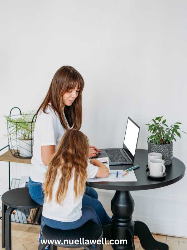 a-mom-keeping-her-kid-busy-while-working-on-her-laptop