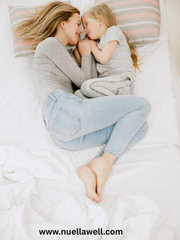 a-mom-and-her-kid-sleeping-on-a-bed