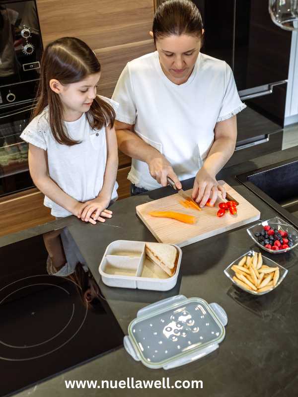 a-mom-and-her-kid-in-the-kitchen-preparing-and-packing-meals