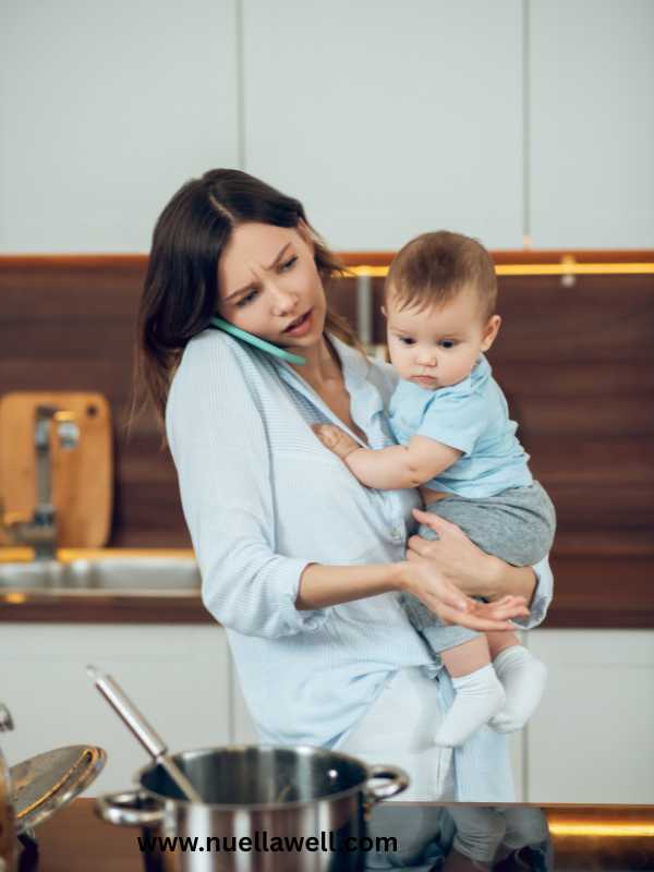 a-stressed-mom-holding-her-kid-and-multitasking-in-stress-management-tips-for-busy-moms