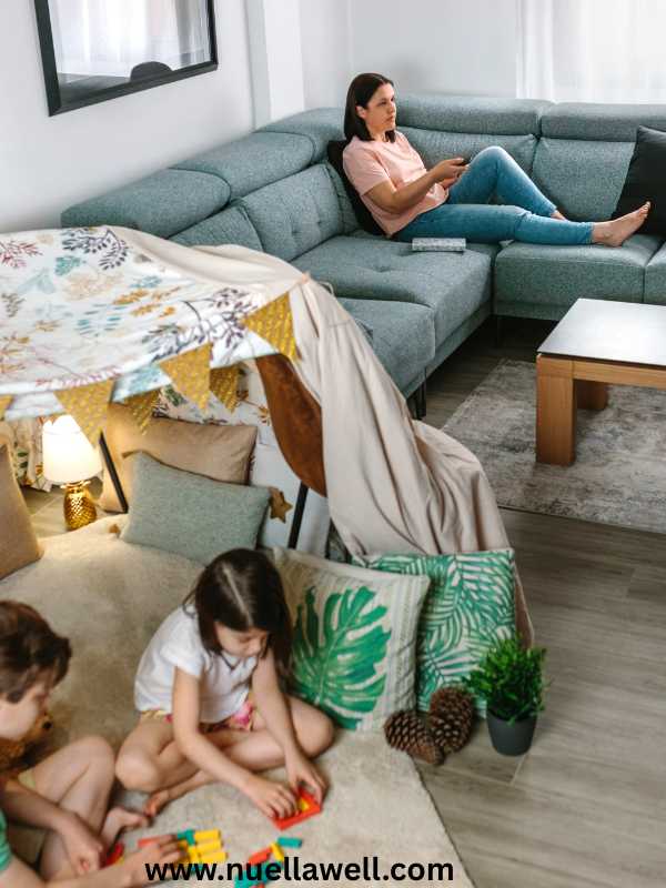 Busy-mom-resting-while-kids-enjoy-independent-screen-free-play.