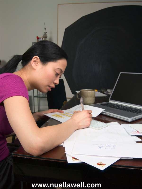 Busy-mom-organizing-school-paperwork-and-family-schedules-before-the-school-year-begins