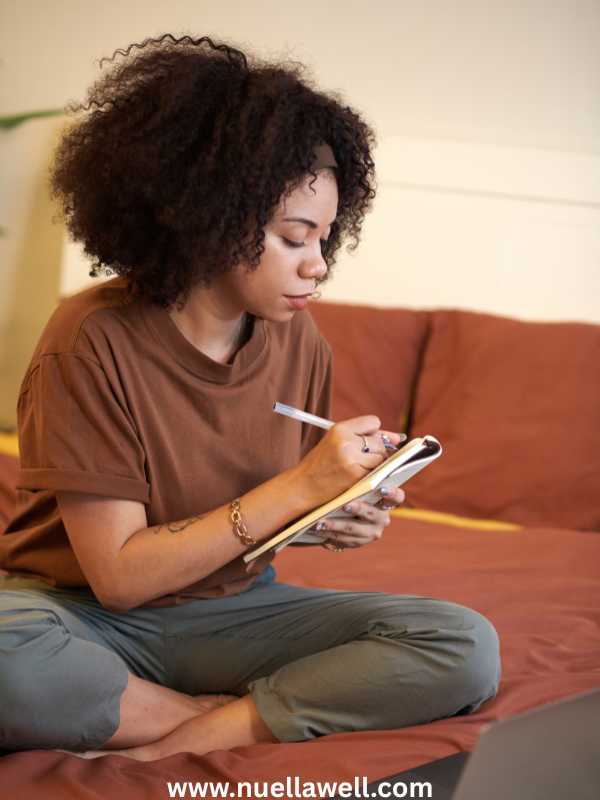 a-mom-journalling-and-prioritizing-her-health-and-well-being-in-why-moms-ignore-their-own-symptoms