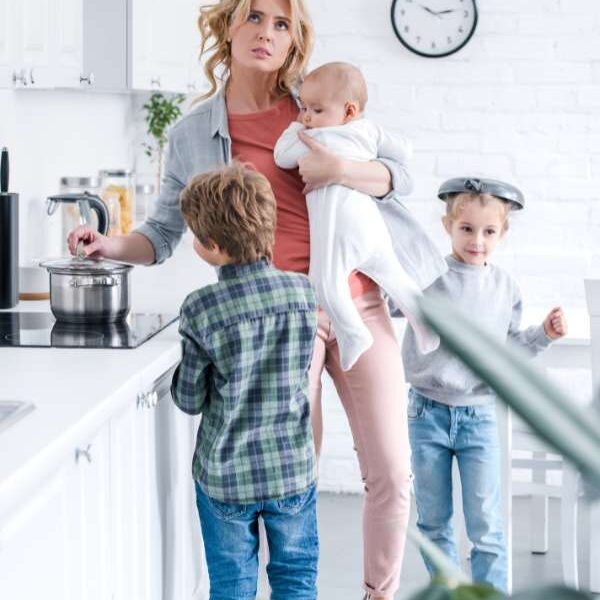 Mom-in-the-kitchen-cooking-with-her-kids-in-summer-burnout-for-moms-during-school-break
